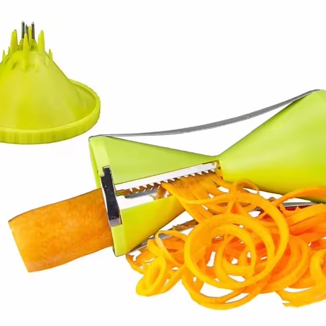 un coupe legume vert 